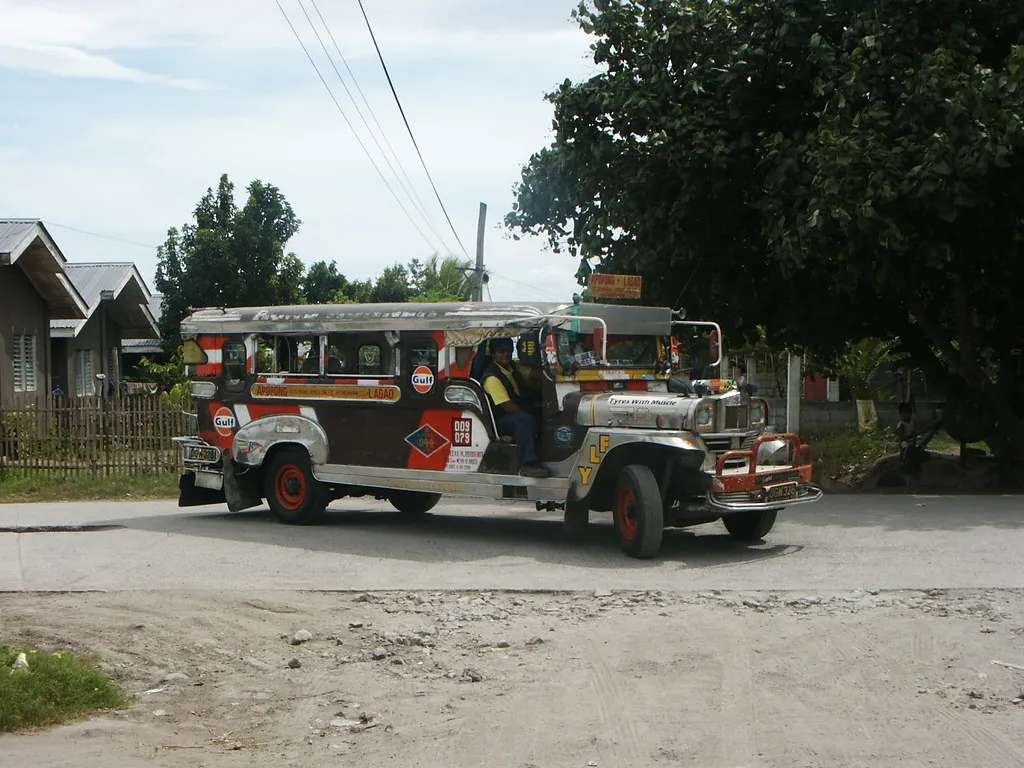 Jeepney parked on a quiet street in a Philippine town